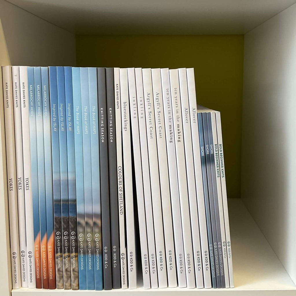 white cube shelf of kate davies knitting design books