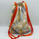 rose gold patterned drawstring project bags for knit crochet filled with 20 mini balls of Opal 4ply sock yarn