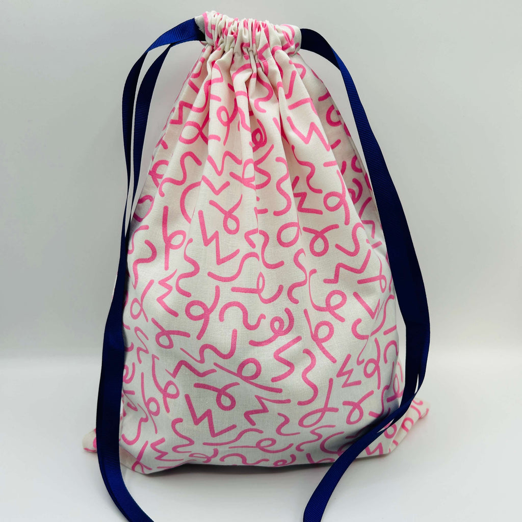 pink patterned drawstring project bags for knit crochet filled with 20 mini balls of Opal 4ply sock yarn