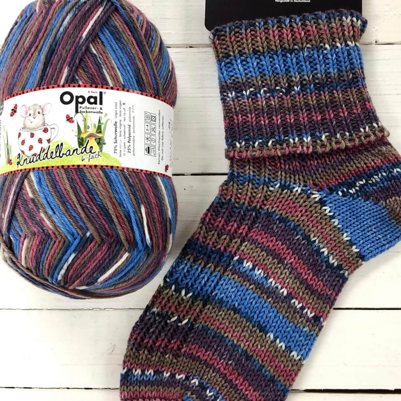 brown and blue knitted sock multicoloured opal 6ply sock wool yarn 