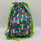 Drawstring bag with colorful mushroom pattern on a blue background