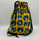 Drawstring bag with bear pattern on a yellow background