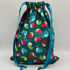 Drawstring bag with colorful bird pattern on a gray background